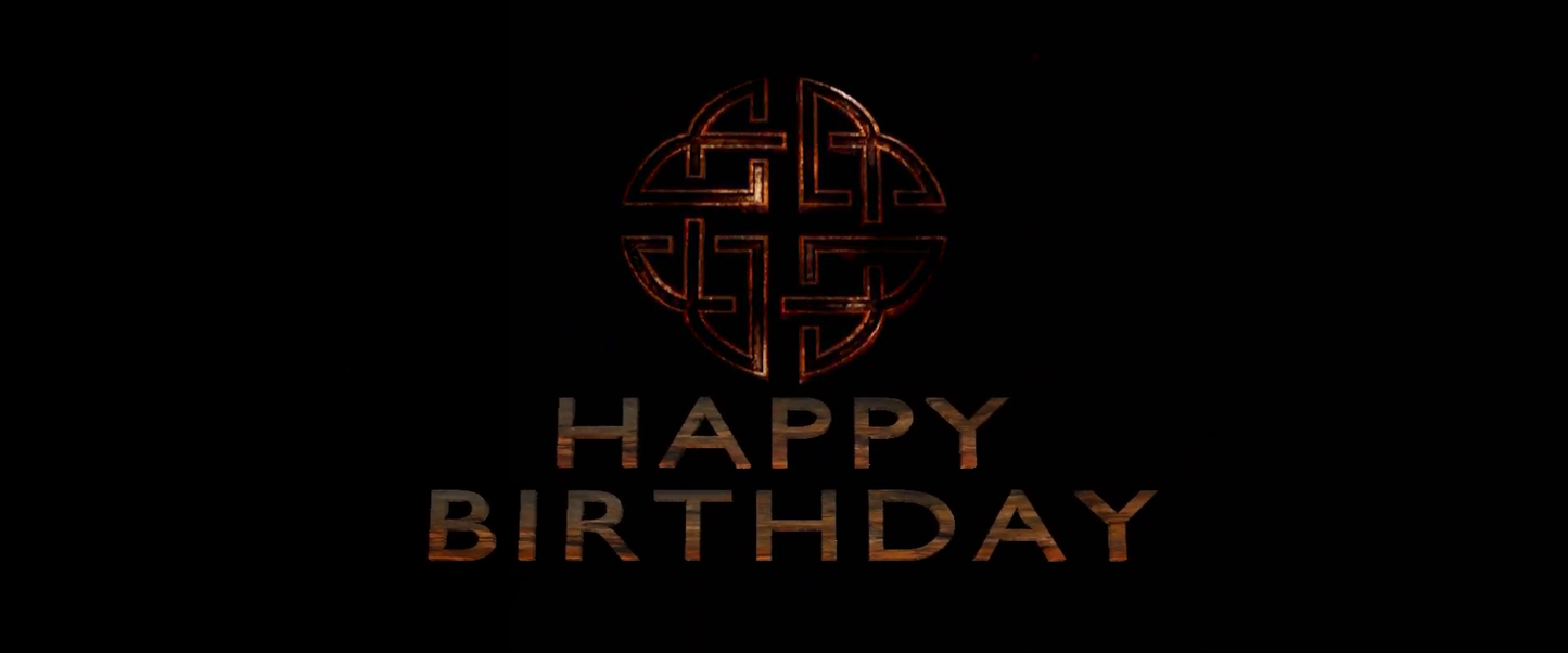 Decorative 'Happy Birthday' text with intricate design on a black background